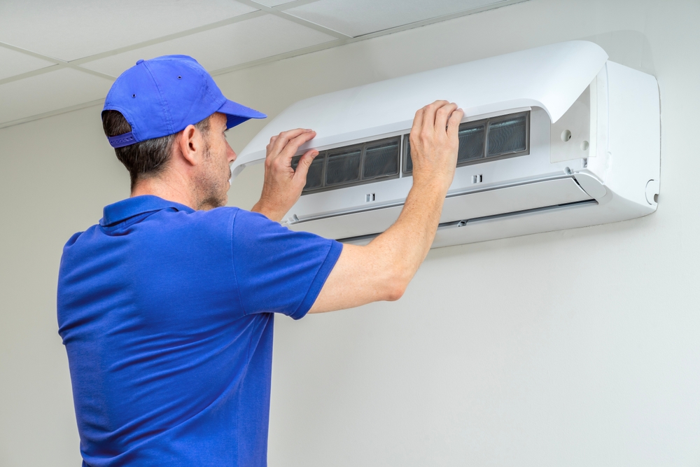 Hvac,technician,performing,air,conditioner,maintenance,inspection.,24,hours,emergency